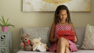 Girl on couch using tablet, B-roll still