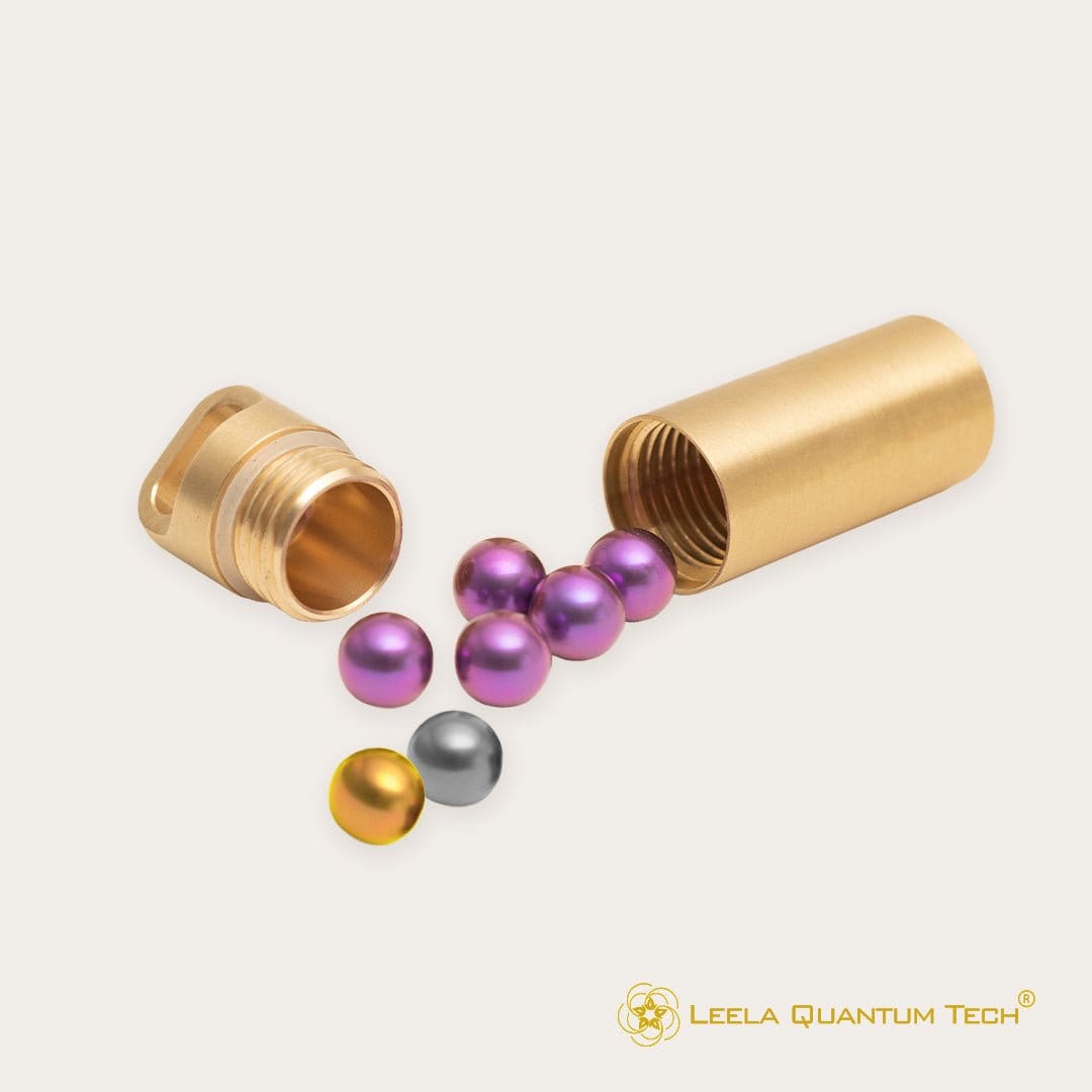 Gold container with colorful spheres.