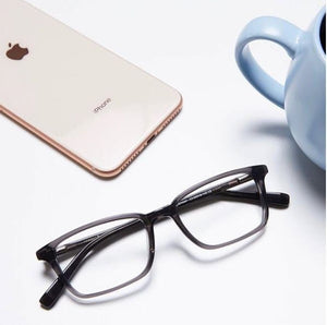 BB2335 eyeglasses with iPhone and coffee cup on white surface.