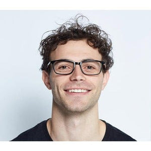 Man wearing BBGPH9OCB9 glasses, smiling.