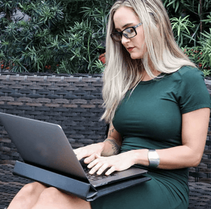 Woman in green dress using laptop (DS_ds-sleeve)