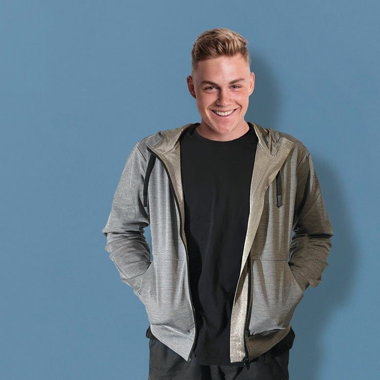 Man in grey hoodie smiles, Def15054