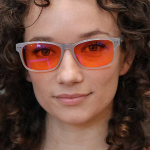 Woman wearing blue light blocking glasses - Def21040