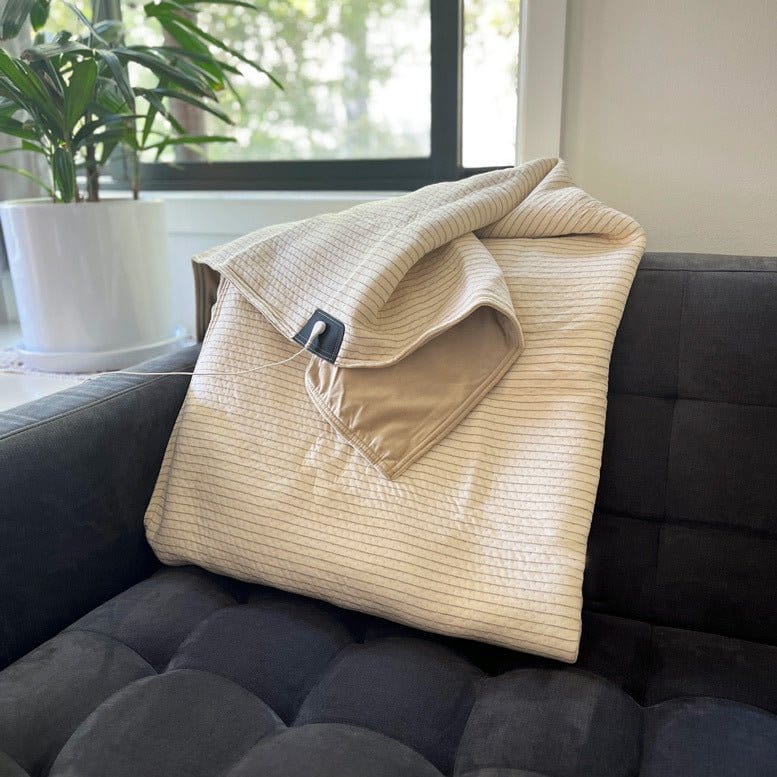 Cream striped blanket on couch