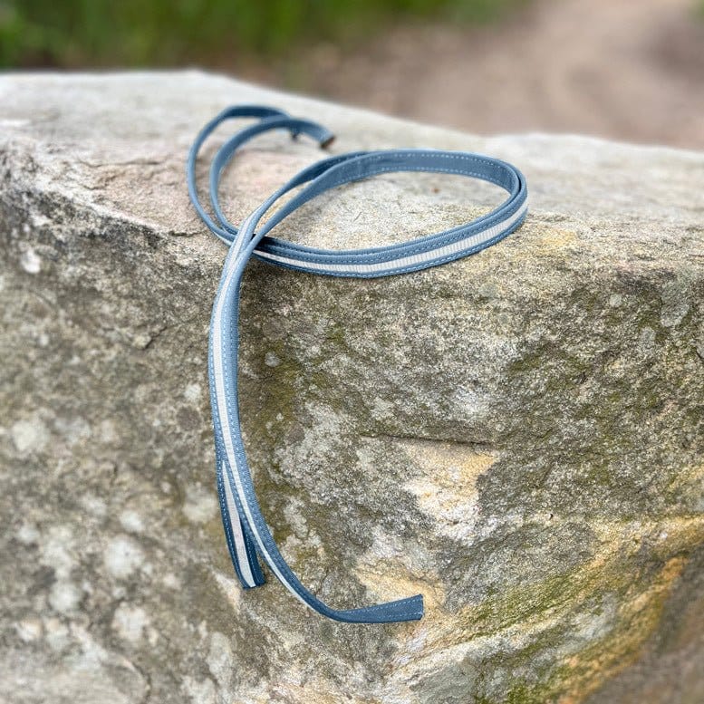 Blue and white strap on a rock