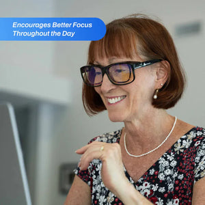 Woman wearing FitOver blue light glasses for better focus