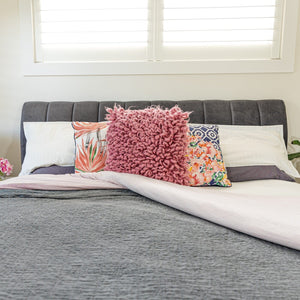 Bedroom with bed, pillows, and GO1804 bedding.