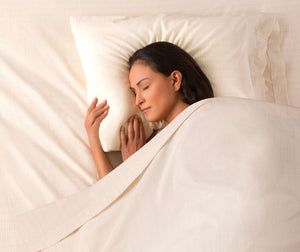 Woman sleeping peacefully in bed