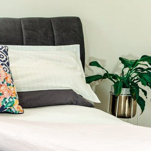 Bed with pillows and plant (GO2905)