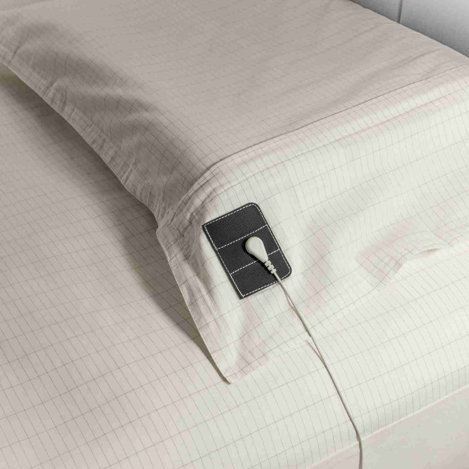 Bed sheet with attached sensor