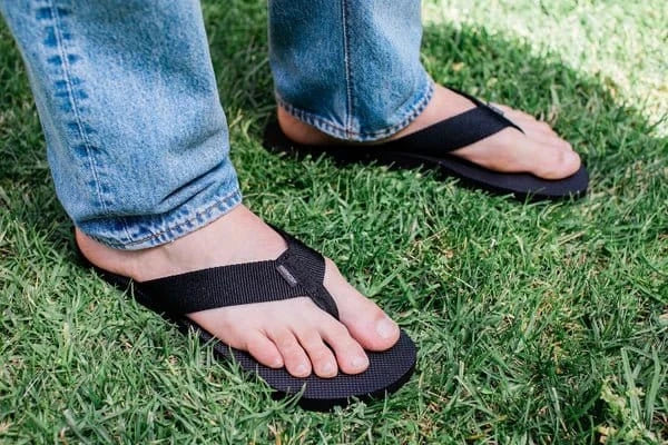 Men's black grounding sandals on grass