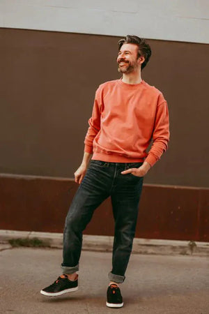 Man in black leather shoes and jeans