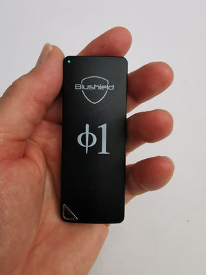 Blushield Φ1 Portable Pendant held in hand