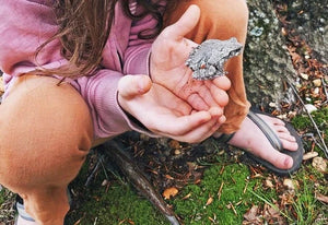 Child holding gray frog, PhotoApr29_62041PM_1