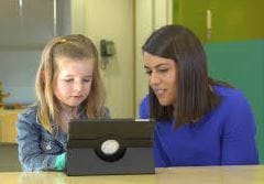 Young girl and teacher using tablet, SS3604