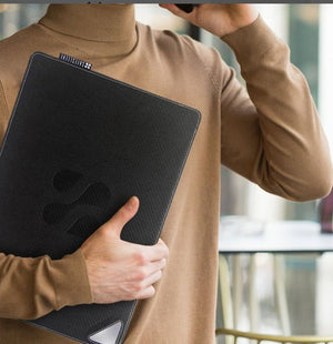 SSLAPDESK laptop case held by person