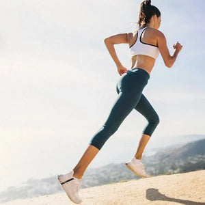 Woman running uphill, screenshot from March 2025.