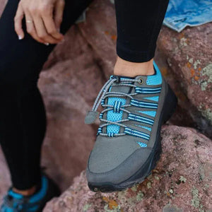 Woman's Taylor Trail shoe on rocks