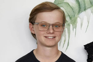 Addison Crystal wearing glasses, smiling