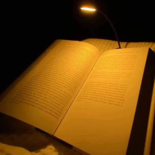 Amber book light illuminating open book