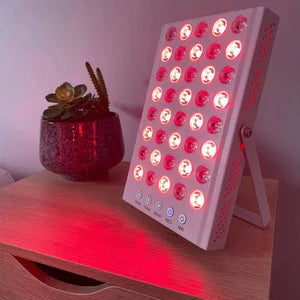 Red light therapy panel emitting red light.