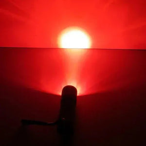 Red light torch blocking blue light