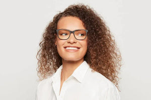 Woman wearing Carter matte black eyeglasses