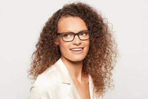 Woman wearing matte black Crane eyeglasses