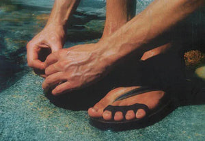 Man's hands and feet, detail of sandal, er117