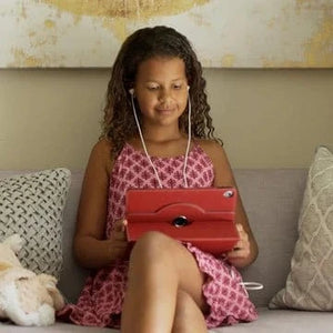 Girl using tablet with red SafeSleeve.