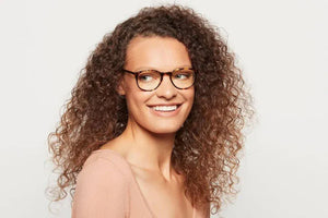 Woman wearing Lane Maple Tortoise eyeglasses