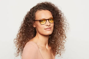 Woman wearing Lane Maple Tortoise eyeglasses