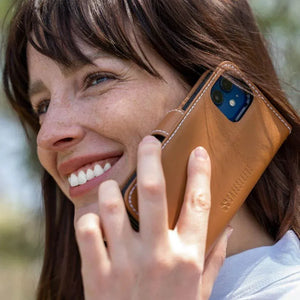 Woman using leather non-detach phone case