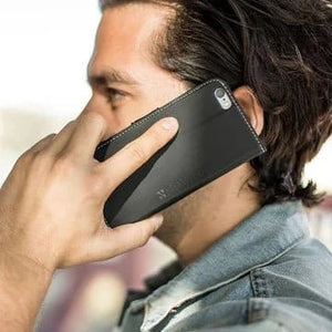 Man using Safesleeve black cell phone case.