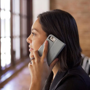 Girl talking on phone with SafeSleeve detachable case