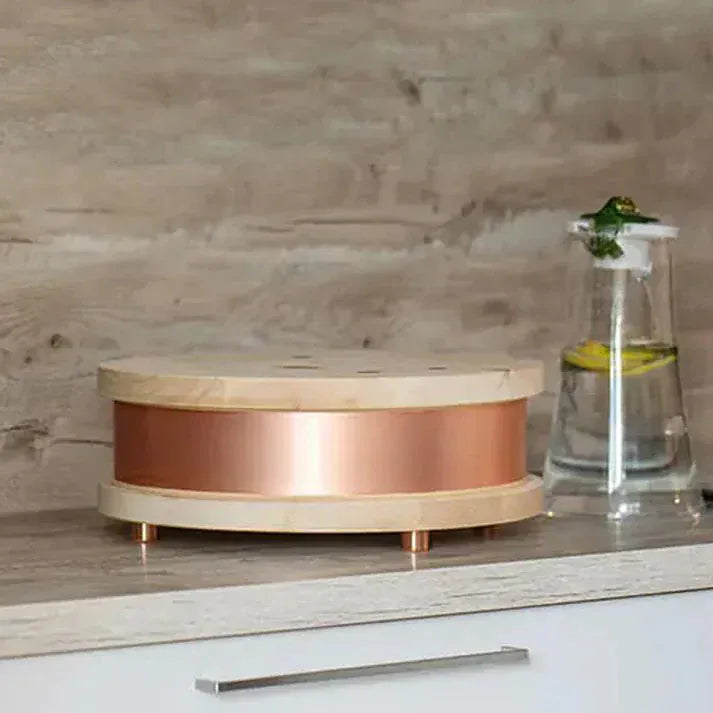 WG-QiHome device with copper band and water feature