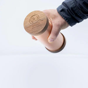 WG-QiShield device held in hand