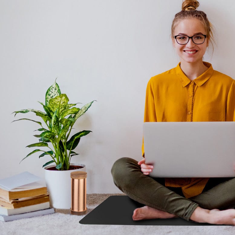 Woman with laptop and WG-QiShield product